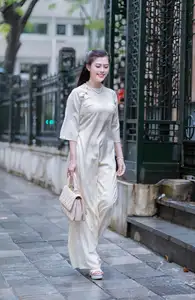 VGU No.162: Modern Ao Dai Grace: Vietnamese Woman's Elegant Style & Allure on City Streets. - image 4