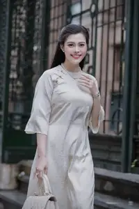 VGU No.162: Modern Ao Dai Grace: Vietnamese Woman's Elegant Style & Allure on City Streets. - image 5