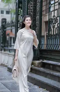 VGU No.162: Modern Ao Dai Grace: Vietnamese Woman's Elegant Style & Allure on City Streets. - image 1