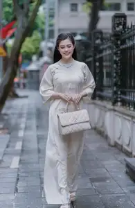 VGU No.162: Modern Ao Dai Grace: Vietnamese Woman's Elegant Style & Allure on City Streets. - image 3