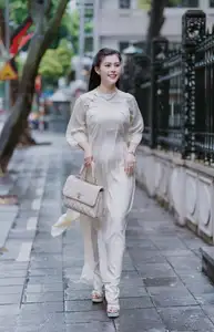 VGU No.162: Modern Ao Dai Grace: Vietnamese Woman's Elegant Style & Allure on City Streets. - image 6