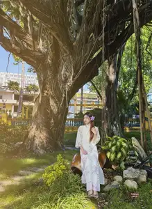 Graceful Ao Dai: Explore the Timeless Traditional Beauty of a Vietnamese Girl with an Elegant Parasol in a Lush Garden Setting - image 8