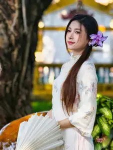 Graceful Ao Dai: Explore the Timeless Traditional Beauty of a Vietnamese Girl with an Elegant Parasol in a Lush Garden Setting - image 5