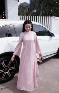 Phan Van Duc's Wife Stuns in Elegant Traditional Ao Dai Amidst Ancient Charm - image 2