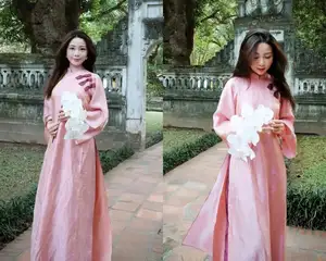 Phan Van Duc's Wife Stuns in Elegant Traditional Ao Dai Amidst Ancient Charm - image 0