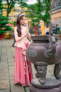 Graceful Woman in Pink Dress Amidst Ancient Heritage Charm 1000025280 - image 2