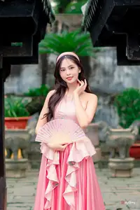 Graceful Woman in Pink Dress Amidst Ancient Heritage Charm 1000025280 - image 6