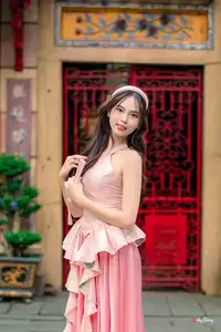 Graceful Woman in Pink Dress Amidst Ancient Heritage Charm 1000025280 - image 1