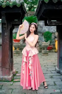Graceful Woman in Pink Dress Amidst Ancient Heritage Charm 1000025280 - image 7
