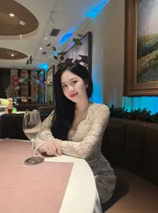 Captivating Beauty: Young Woman in Elegant Lace Dress Shines in Luxurious Restaurant Setting. - image 0