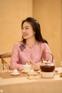 Asian Grace: Vietnamese Woman's Radiant Smile & Elegant Tea Moment - image 7