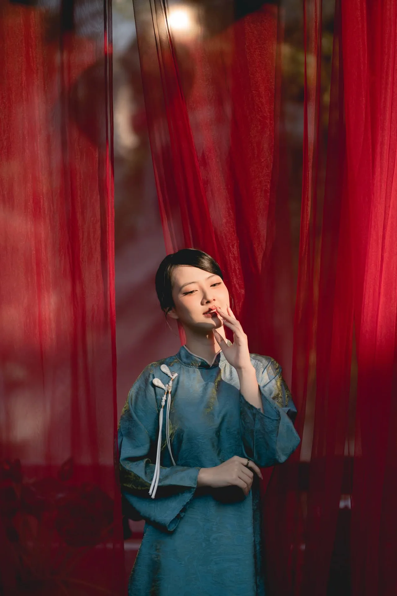 Classic Elegance: Vietnamese Tradition in Blue Silk and Pink Lilies