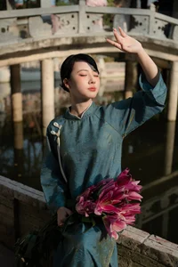 Classic Elegance: Vietnamese Tradition in Blue Silk and Pink Lilies - image 5