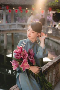 Classic Elegance: Vietnamese Tradition in Blue Silk and Pink Lilies - image 7