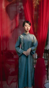 Classic Elegance: Vietnamese Tradition in Blue Silk and Pink Lilies - image 2