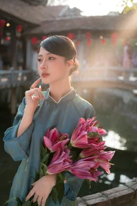Classic Elegance: Vietnamese Tradition in Blue Silk and Pink Lilies - image 9