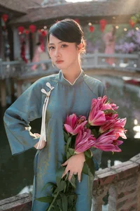 Classic Elegance: Vietnamese Tradition in Blue Silk and Pink Lilies - image 4