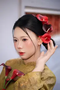 Graceful Vietnamese Ao Dai: Traditional Beauty Adorned with Red Calla Lilies - image 5