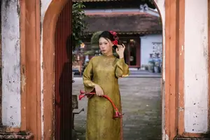 Graceful Vietnamese Ao Dai: Traditional Beauty Adorned with Red Calla Lilies - image 11