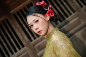 Graceful Vietnamese Ao Dai: Traditional Beauty Adorned with Red Calla Lilies - image 6