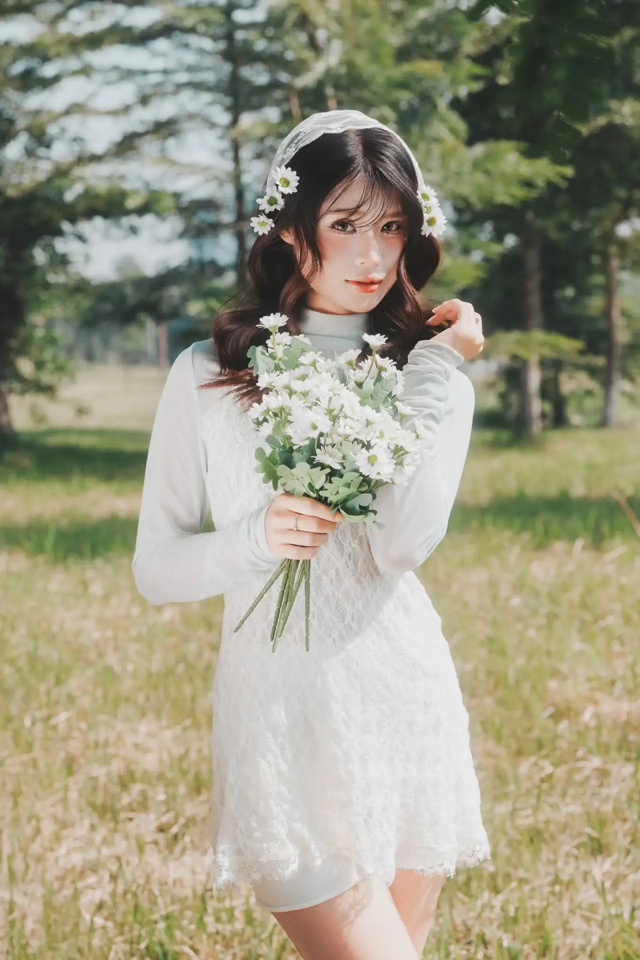 Ethereal Beauty: Young Woman in White Lace Dress Amidst Daisy Field Under Summer Sun