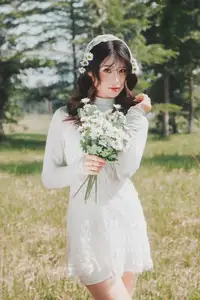 Ethereal Beauty: Young Woman in White Lace Dress Amidst Daisy Field Under Summer Sun - image 0