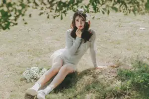 Ethereal Beauty: Young Woman in White Lace Dress Amidst Daisy Field Under Summer Sun - image 3