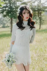 Ethereal Beauty: Young Woman in White Lace Dress Amidst Daisy Field Under Summer Sun - image 9
