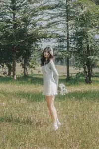 Ethereal Beauty: Young Woman in White Lace Dress Amidst Daisy Field Under Summer Sun - image 6