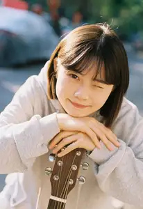 Discover Xin Yue's Captivating Youthful Charm with Guitar in the YiTuYu Vol.8587 Collection. - image 1