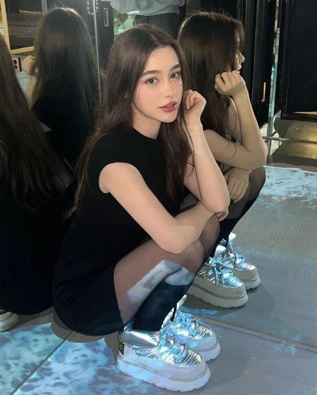 Russian Social Media Sensation Captivates Millions with Stunning Doll-Like Features and Fashion