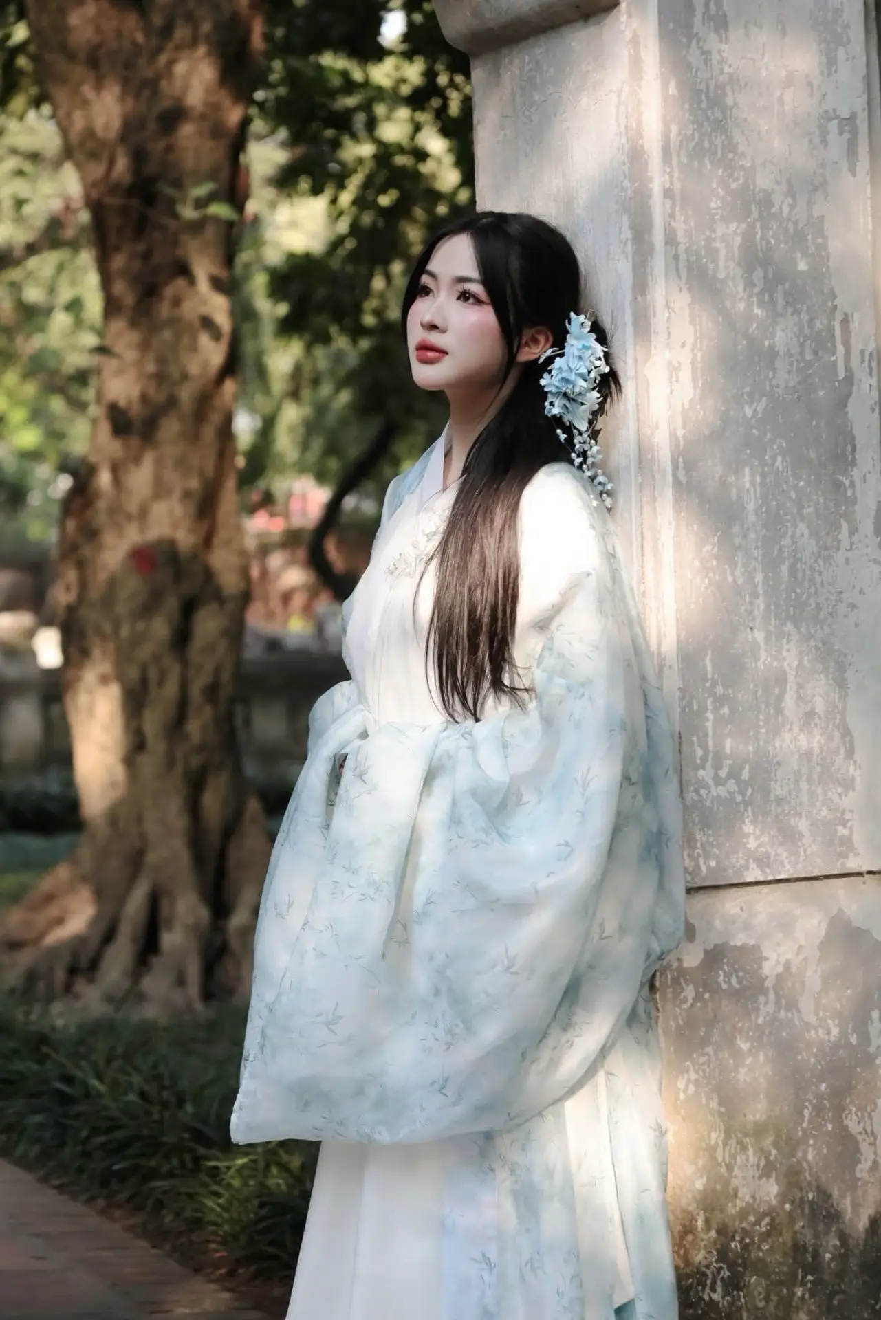 Discovering Traditional East Asian Beauty: Elegant Young Woman in Ancient Vietnamese Setting