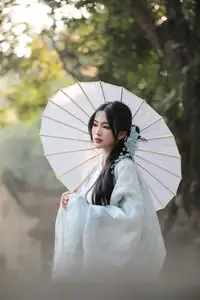 Discovering Traditional East Asian Beauty: Elegant Young Woman in Ancient Vietnamese Setting - image 2