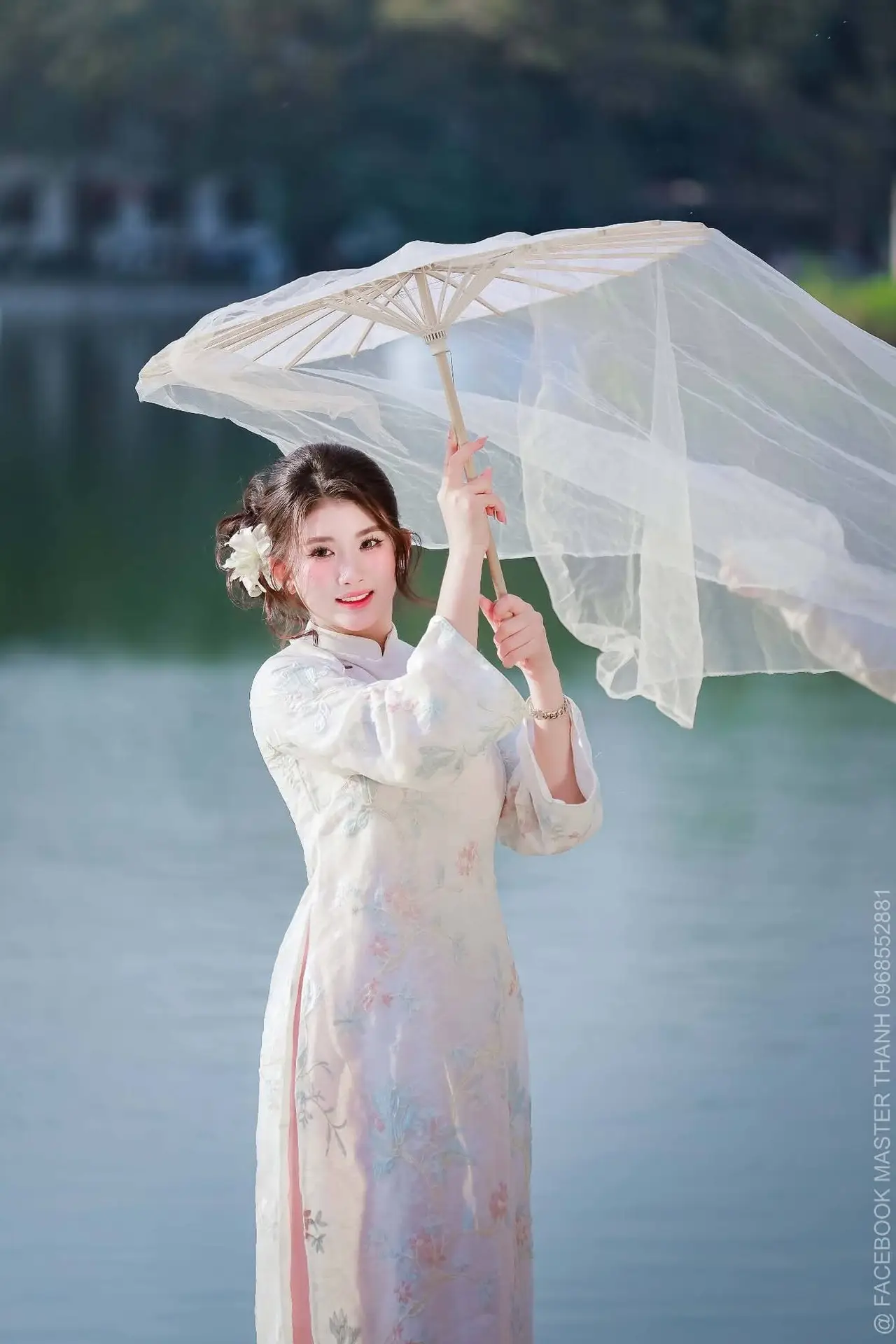Enchanting East Asian Beauty: A Serene Muse in White Cheongsam under Soft Sunlight by the Lake.