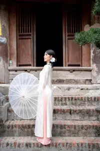 Elegant Asian Beauty: A Portrait of Grace with Traditional Paper Umbrella - Captivating Serenity - image 0