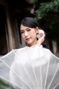 Elegant Asian Beauty: A Portrait of Grace with Traditional Paper Umbrella - Captivating Serenity - image 1