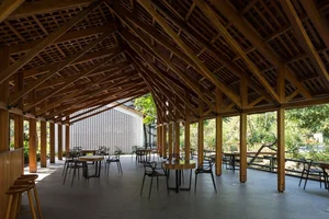 Architectural Marvels: The Stunning Curved Wooden Restaurant Nestled in Hanoi's Lush Forest - image 1