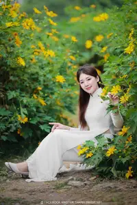 Radiant Youth: Vietnamese Girl in Elegant White Ao Dai Amidst Golden Blooms - image 22