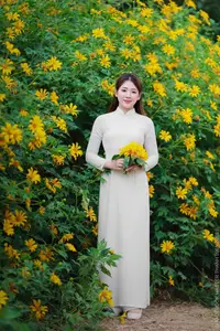 Radiant Youth: Vietnamese Girl in Elegant White Ao Dai Amidst Golden Blooms - image 13