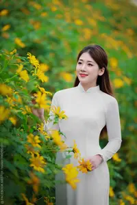 Radiant Youth: Vietnamese Girl in Elegant White Ao Dai Amidst Golden Blooms - image 7