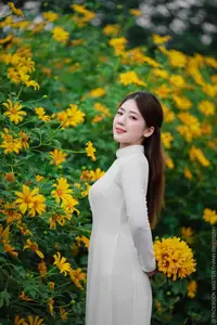 Radiant Youth: Vietnamese Girl in Elegant White Ao Dai Amidst Golden Blooms - image 10