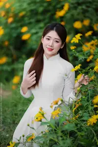 Radiant Youth: Vietnamese Girl in Elegant White Ao Dai Amidst Golden Blooms - image 21