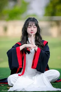 Graceful Vietnamese Girl in Elegant White Ao Dai with Sweet Finger Heart Gesture - image 4