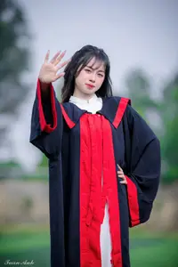 Graceful Vietnamese Girl in Elegant White Ao Dai with Sweet Finger Heart Gesture - image 1