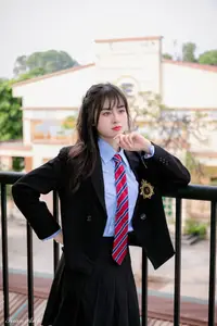 Graceful Vietnamese Girl in Elegant White Ao Dai with Sweet Finger Heart Gesture - image 3