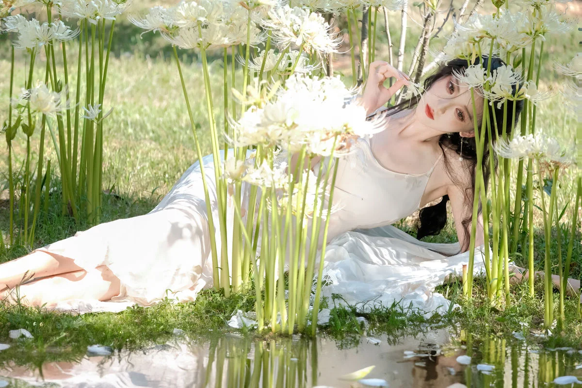 Ethereal Beauty in a White Flower Field: A Muse Under the Sun