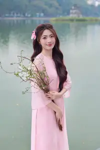 Gentle Pink Ao Dai: Vietnamese Beauty Shines by Hoan Kiem Lake in Spring Hanoi - image 1