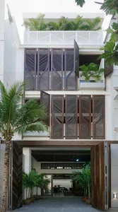 Modern Eco-Friendly Home Design Inspired by Tropical Coconut Leaves in Ho Chi Minh City: A Sustainable Architectural Masterpiece with Split-Level Living - image 0