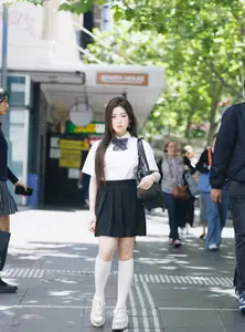 Charming Schoolgirl Embraces Street Style with Classic Uniform. - image 3