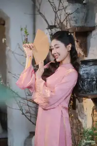 Serene Beauty of a Lady in Pink Traditional Dress with Spring Blossoms - image 14
